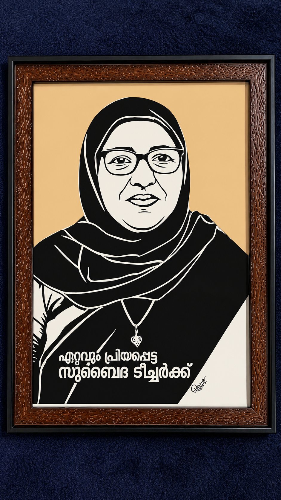 Framed paper-cut portrait tribute to a teacher against a navy backdrop