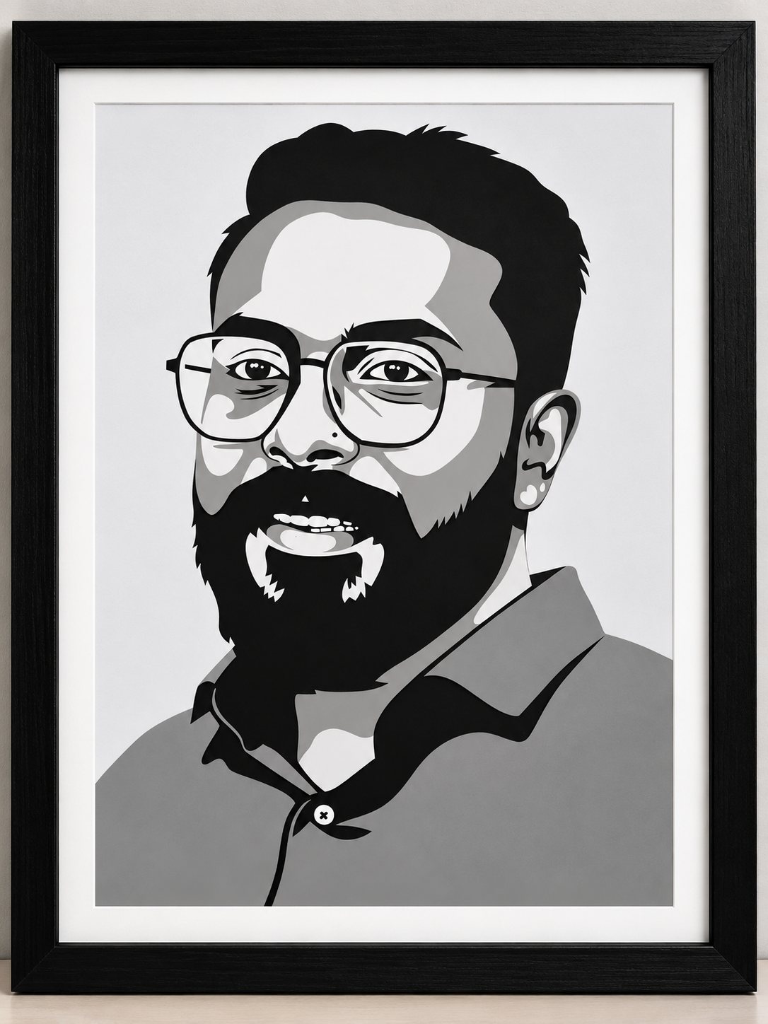 Framed paper-cut portrait of a bearded man wearing glasses